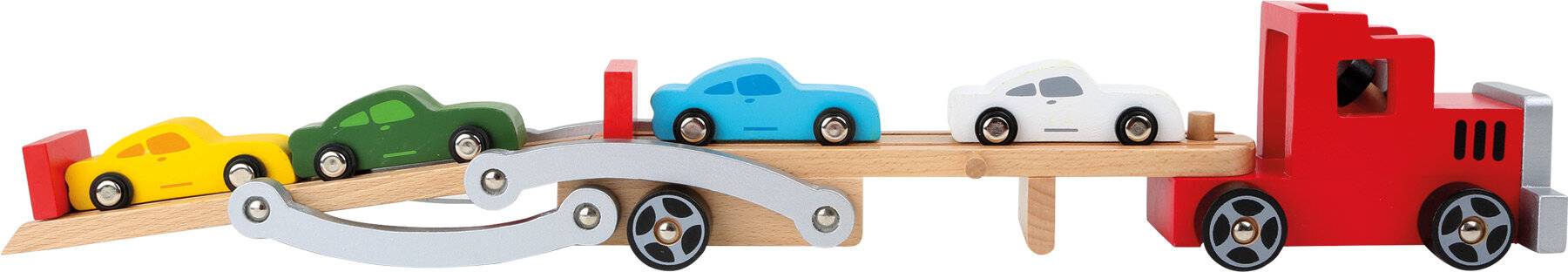 Ein blaues Spielzeugauto steht auf einer Holzrampe, mit einem größeren Rad und einem Bolzen darunter, was eine Bewegung oder ein mechanisches Konzept andeutet.