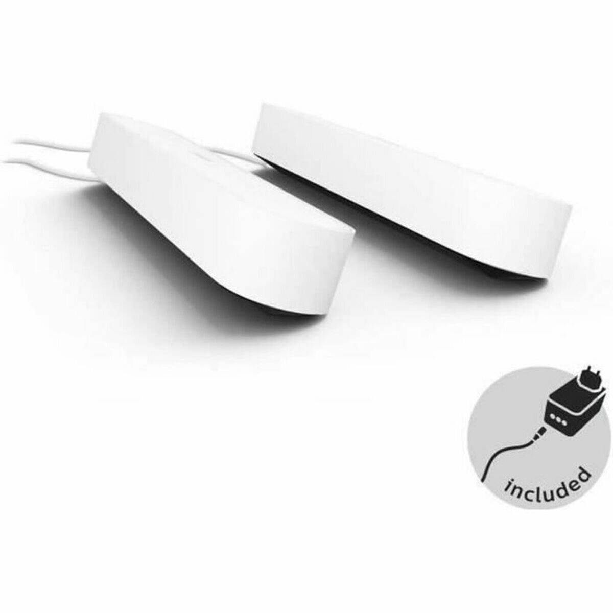 Zwei weiße rechteckige Geräte mit Kabeln, in Perspektive dargestellt. Eine kreisförmige Einblendung zeigt ein Stecker-Symbol mit dem Text ‚inklusive'.