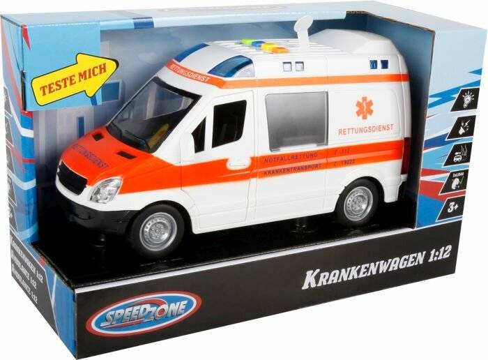 Ein Spielzeug-Krankenwagen wird in seiner Verpackung präsentiert; er weist ein weiß-orangefarbenes Design mit Blaulicht auf dem Dach auf. Auf der Seite steht 'Rettungsdienst'.