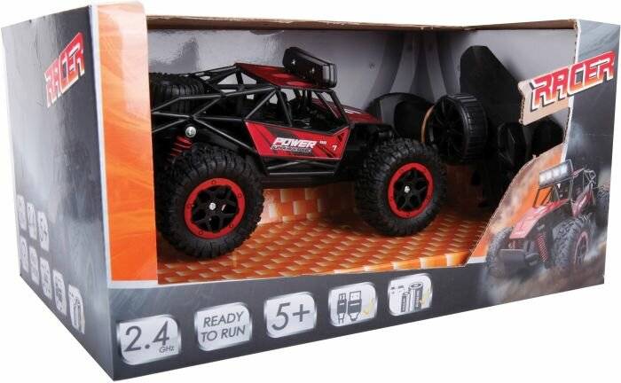 Ein rot-schwarzer Spielzeug-Monstertruck in einer Schachtel. Die Schachtel zeigt Symbole, die darauf hinweisen, dass er für Kinder ab 5 Jahren geeignet ist und über 2,4-GHz-Fernsteuerung verfügt.