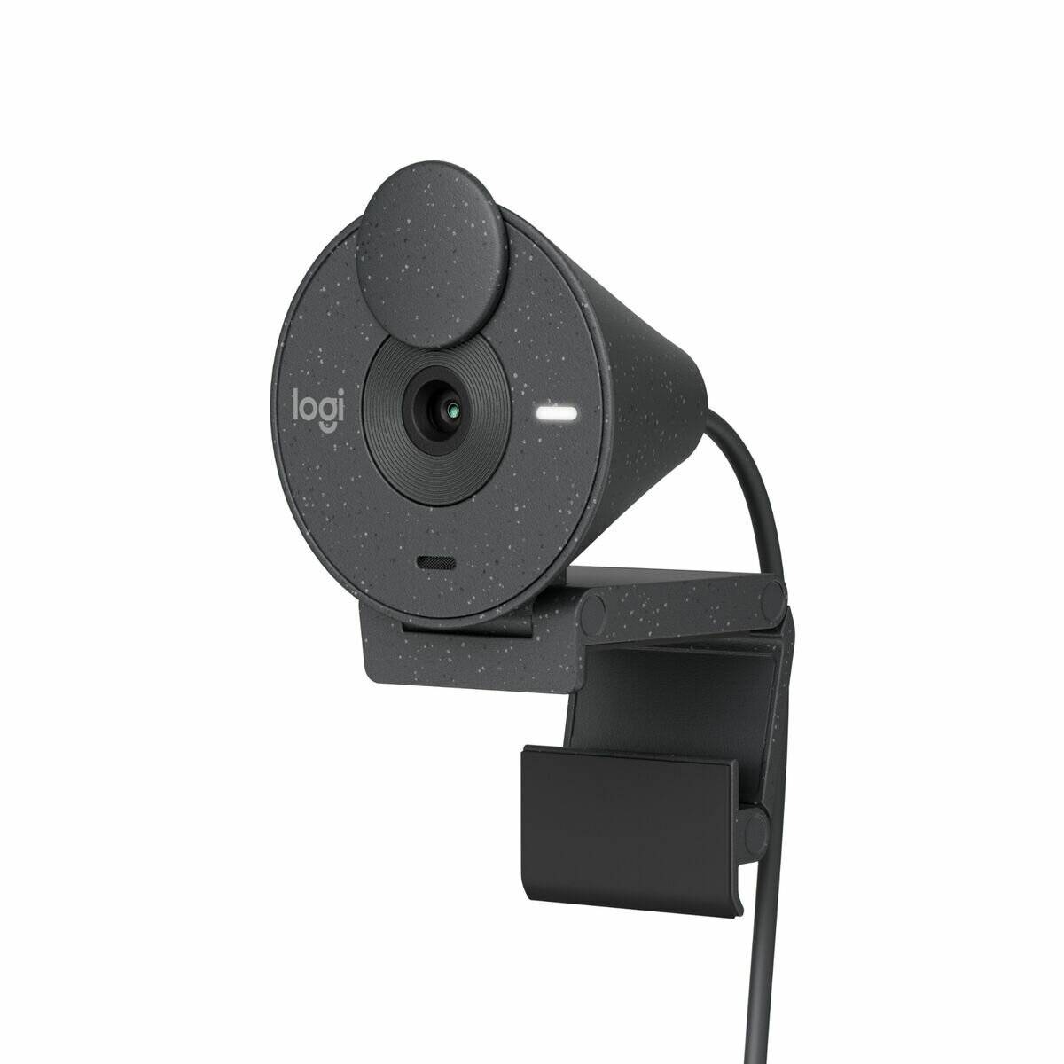 Eine Webcam mit kreisförmiger Gestalt und gesprenkelte Optik, ausgestattet mit integriertem Sichtschutz und Befestigungsclip.