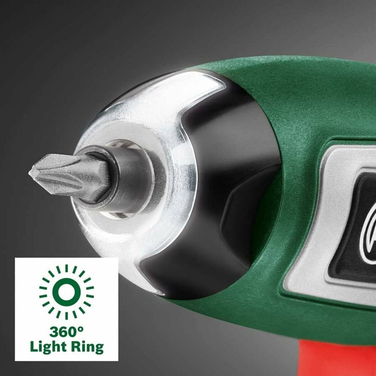 Eine Nahaufnahme eines grünen elektrischen Schraubenziehers mit einem einsatzbereiten Bit. Das Bild hebt ein besonderes Merkmal hervor: den ‚360° Lichtring' für bessere Sichtbarkeit.