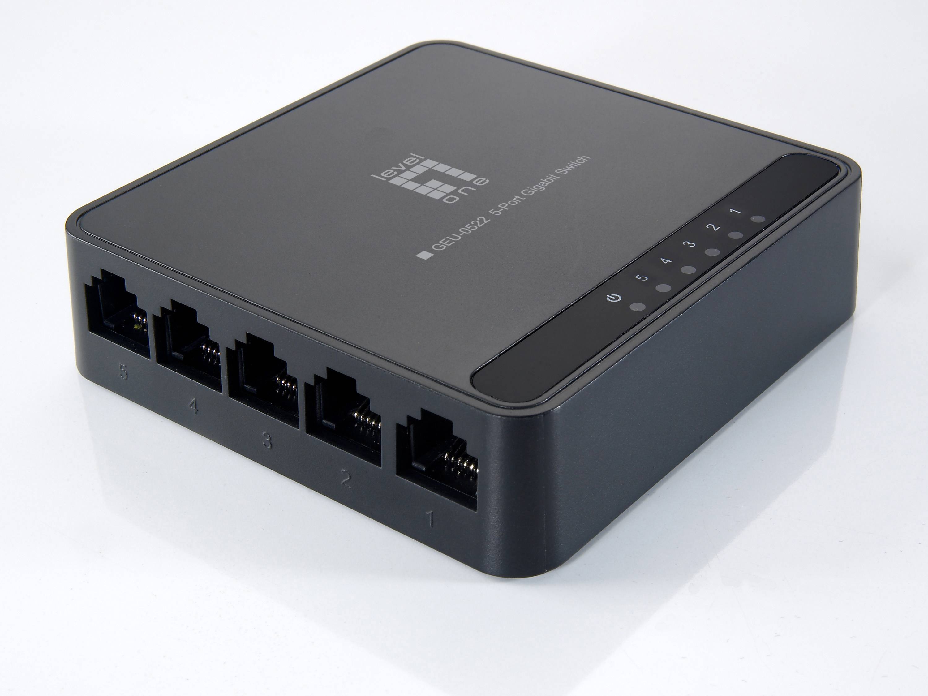 Kleiner schwarzer Ethernet-Netzwerk-Switch mit fünf RJ45-Anschlüssen und Status-LEDs auf der Oberseite.