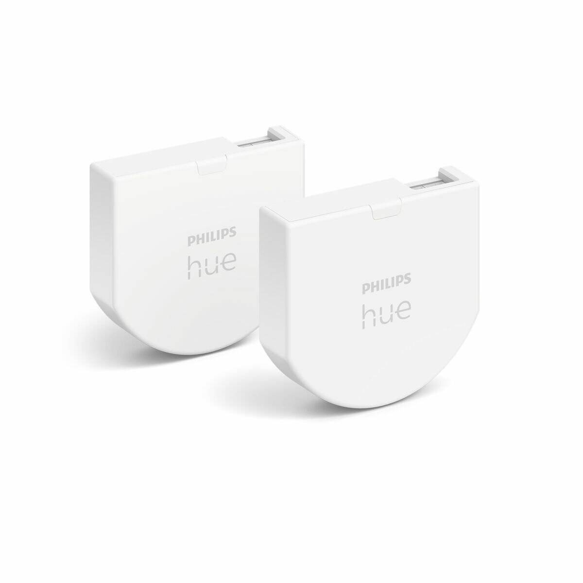 Zwei weiße Philips Hue Smart-Beleuchtungsmodule, die für die Integration in Smart-Home-Systeme entwickelt wurden, nebeneinander auf weißem Hintergrund platziert.