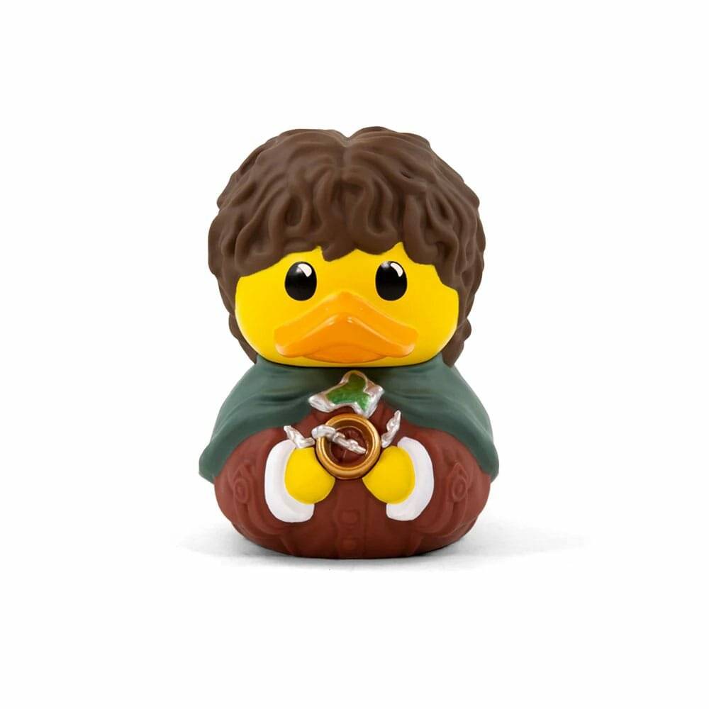 Eine Spielzeugente, verkleidet als Figur mit lockigem braunem Haar, die einen grünen Umhang trägt und einen Ring in ihrem Flügel hält.