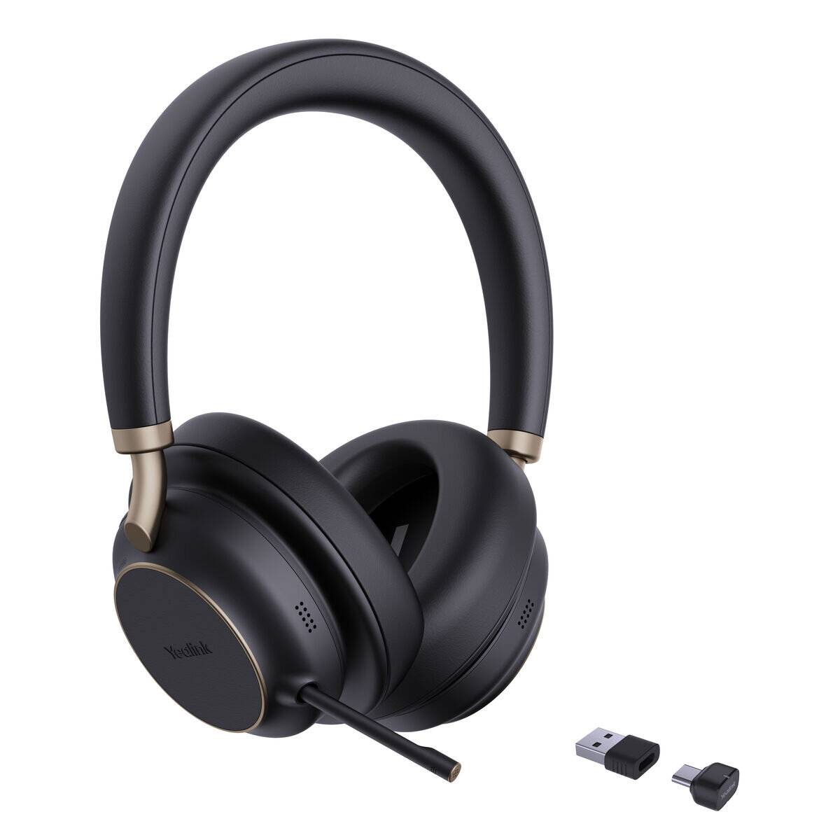 Schwarze drahtlose Over-Ear-Kopfhörer mit goldener Akzentierung und Mikrofon, neben einem USB-Dongle und Adapter für die Konnektivität.