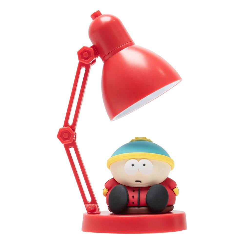 Eine rote Schreibtischlampe mit einer Zeichentrickfigur als Sockel, die ein rundes Gesicht, eine blaue Mütze und einen roten Anzug trägt und im Schneidersitz sitzt.