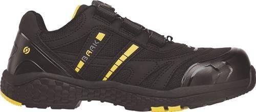 Ein schwarzer und gelber Wanderschuh mit robusten Sohlen, auf dessen Seite das Wort 'BAAK' zu sehen ist, vor einem neutralen Hintergrund.