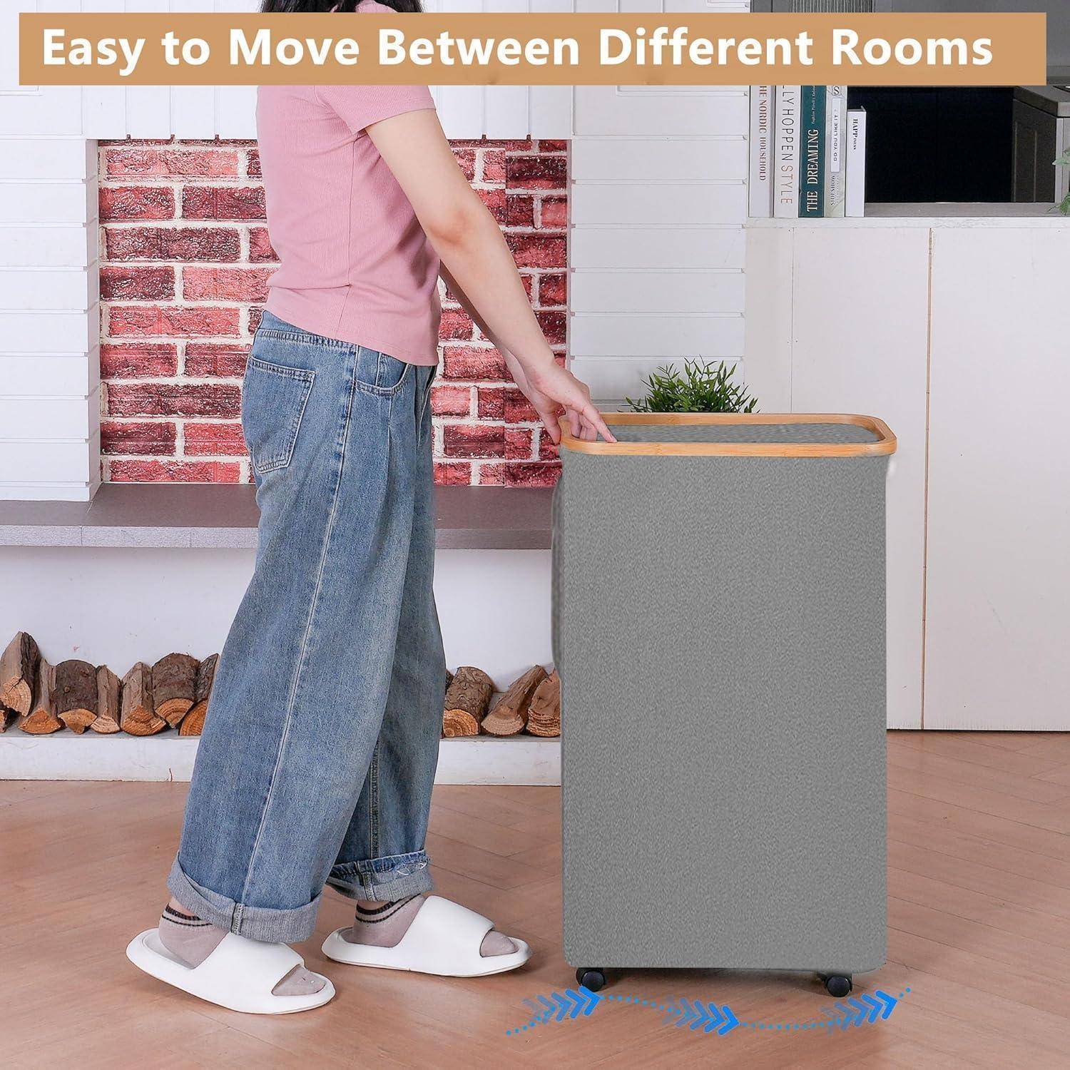 Person in casual clothes moves a gray, wheeled laundry basket across a room. Text reads 'Leicht zwischen verschiedenen Räumen zu bewegen'.