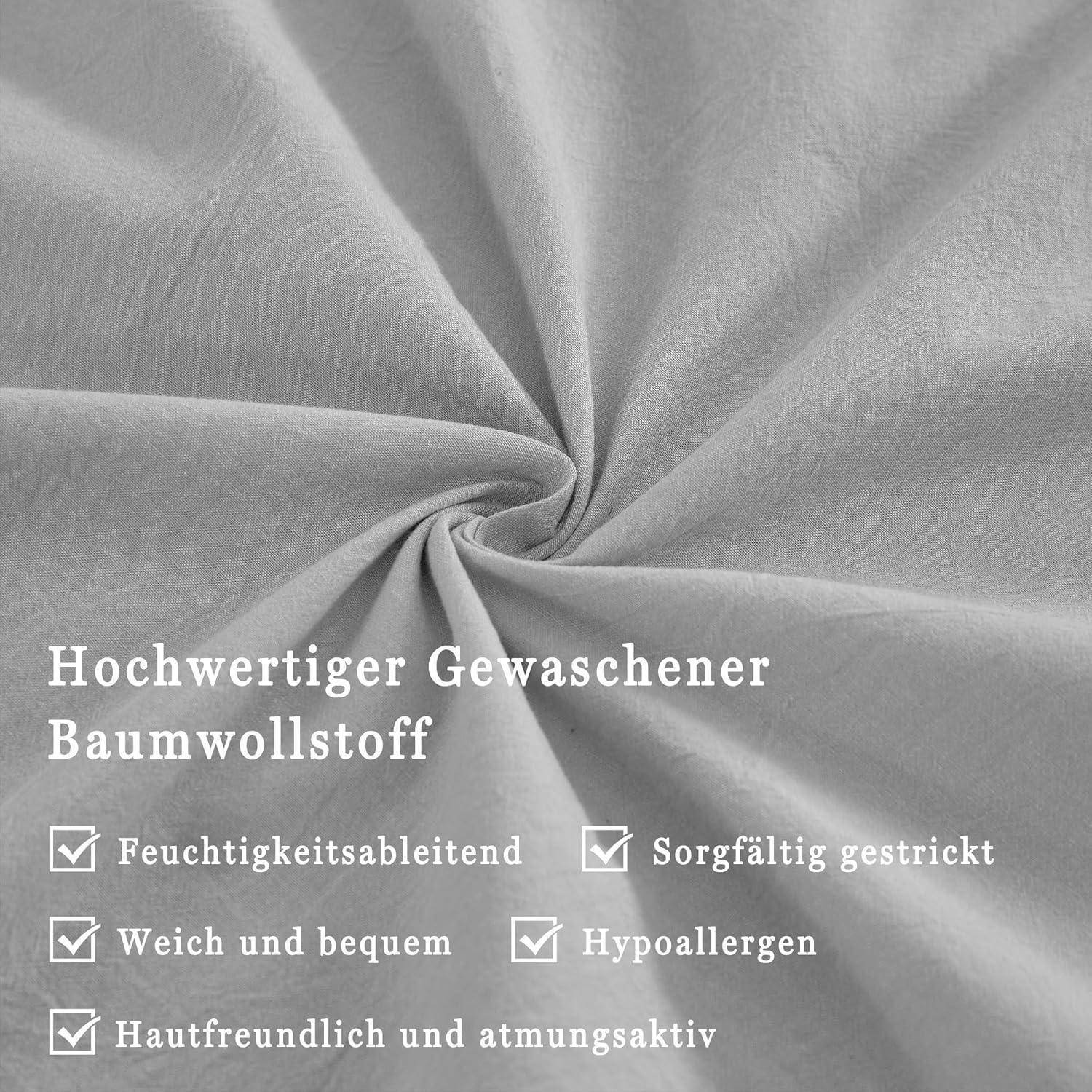 Graue Stoffprobe mit Texthervorhebungen: 'Hochwertige gewaschene Baumwollfaser', 'Feuchtigkeitsableitend', 'Weich und komfortabel', 'Hypoallergen', 'Hautfreundlich und atmungsaktiv'.