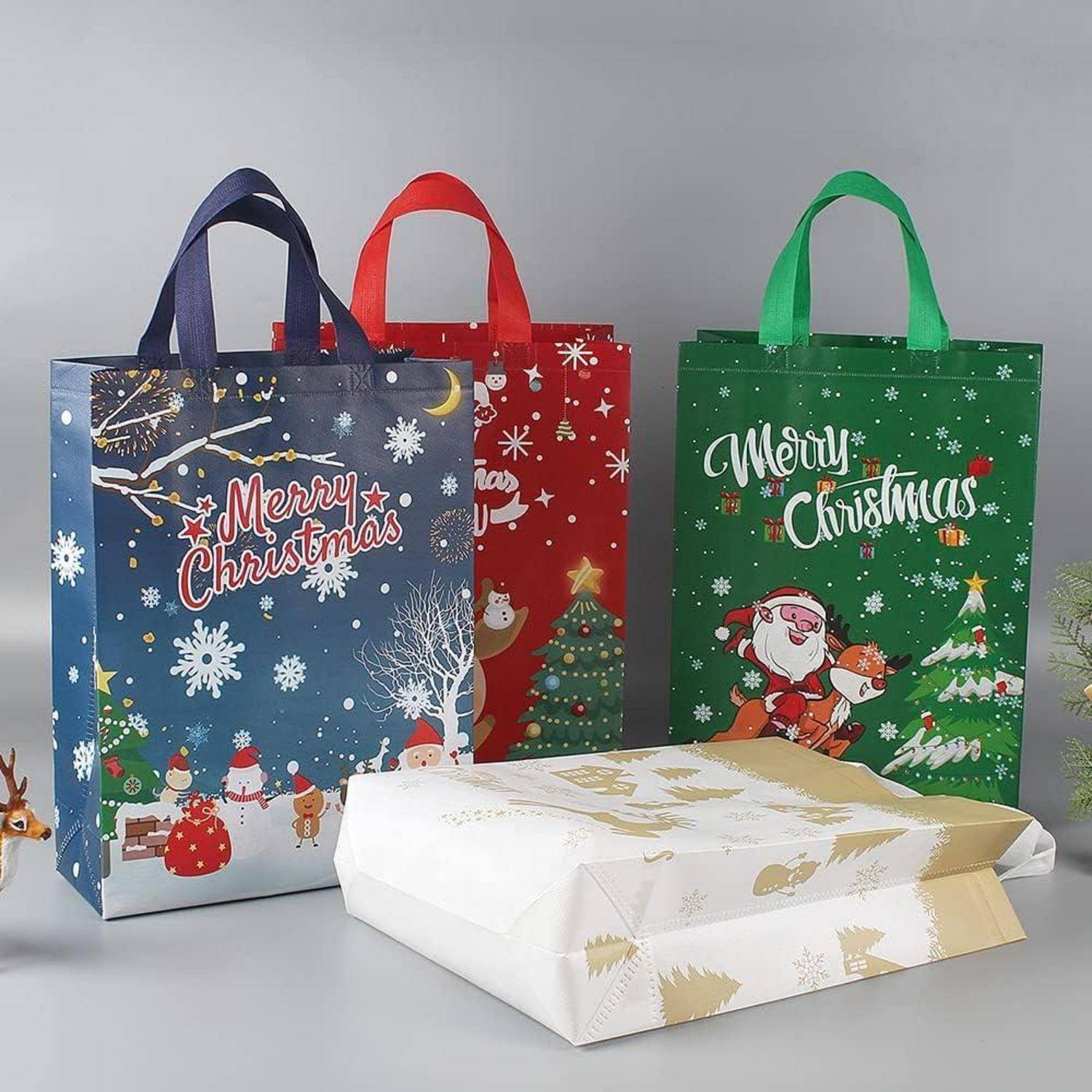 Weihnachtstragetaschen Geschenktüten Vliesstoff Griff 5er grün