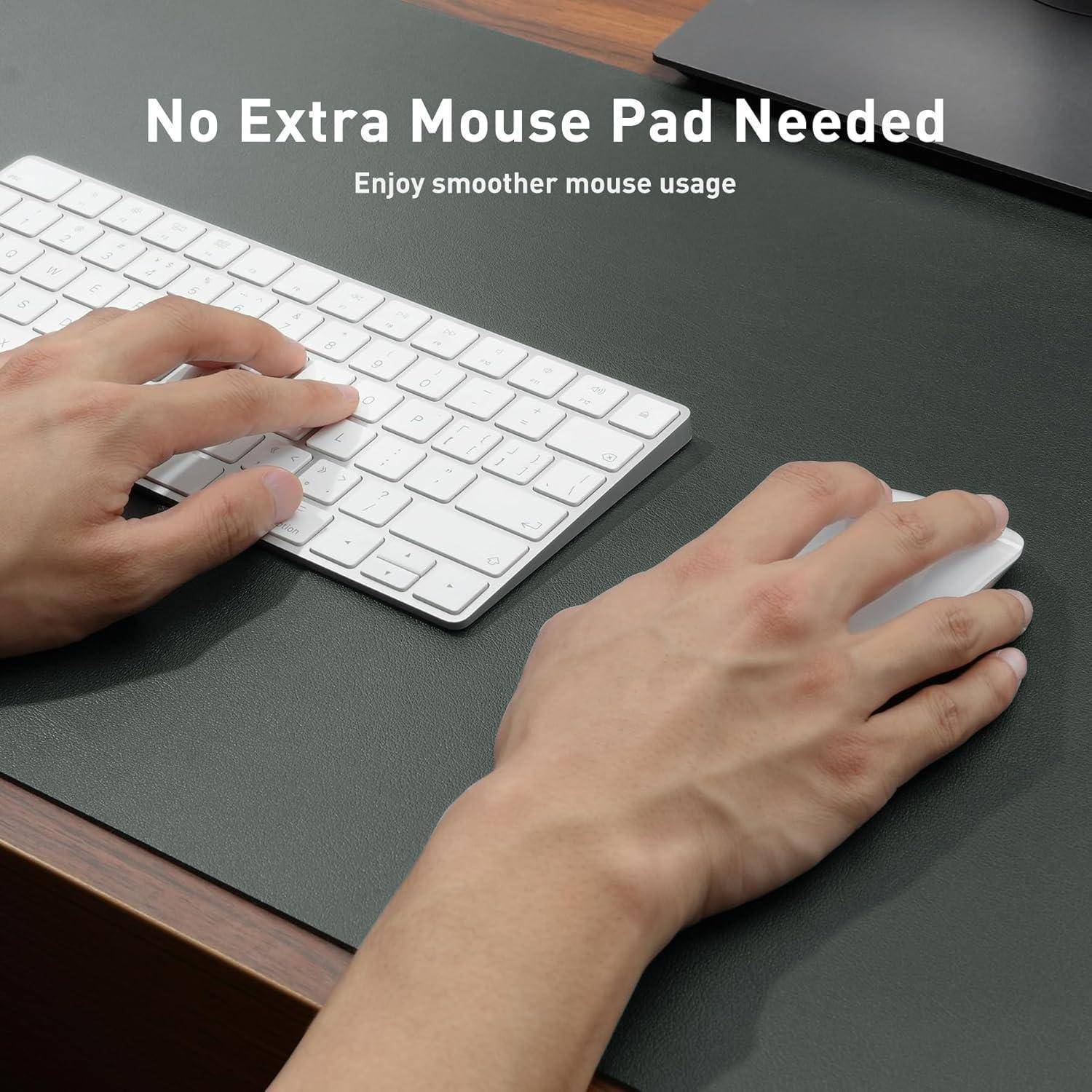 Hände, die eine drahtlose Tastatur und Maus auf einer dunklen Oberfläche verwenden, mit dem Text: 