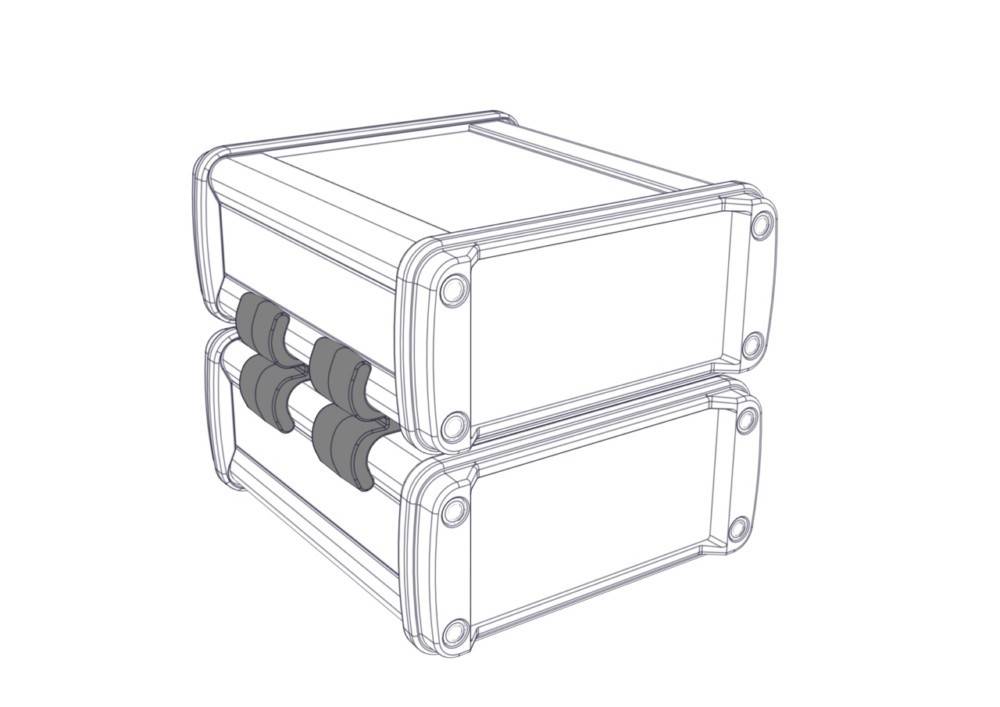 Zwei gestapelte rechteckige Kisten mit abgerundeten Ecken und drei hervorstehenden Elementen an einer Seite, was auf ein modulares oder anschließbares Design hindeutet.