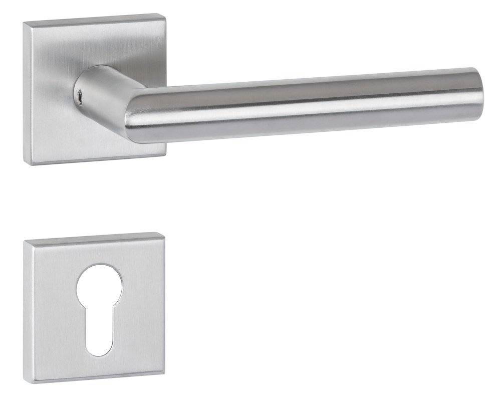 Ein einfacher zylindrischer Metallhaken ragt aus einer dunkel strukturierten Wand hervor und wirft einen kleinen Schatten, was Funktionalität und minimalistisches Design andeutet.