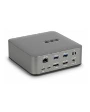 Ein kleines, rechteckiges silbernes elektronisches Gerät mit verschiedenen Anschlüssen auf seiner Vorderseite, einschließlich USB-, HDMI- und Ethernet-Verbindungen.