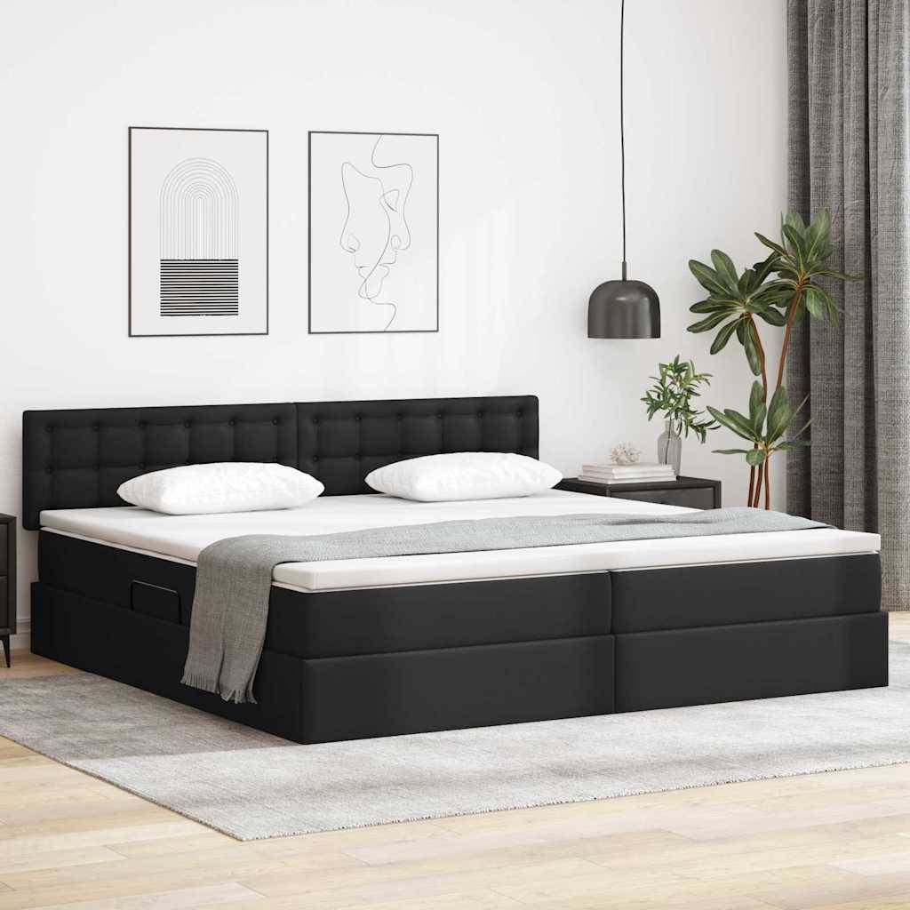 Ein modernes Schlafzimmer mit einem Bett mit schwarzem Polsterbezug, weißer Bettwäsche, einer grauen Decke und zwei abstrakten Bildern in Rahmen an einer weißen Wand.