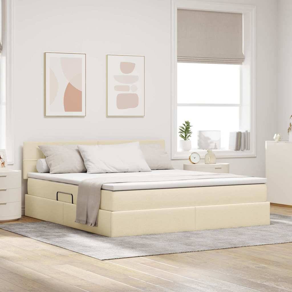 Ein minimalistisches Schlafzimmer mit einem creme-farbenen Plattformbett, weißer Bettwäsche und zwei abstrakten Kunstwerken an der Wand. Natürliches Licht erfüllt den Raum.