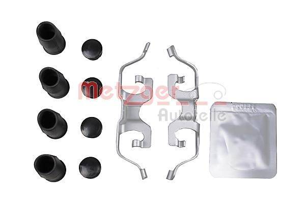 Bremsanschluss-Set mit Gummikappen, Metallklammern und einer Plastiktüte auf weißem Hintergrund.