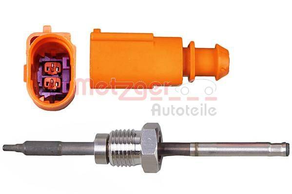 Ein orangefarbener Automotive-Sensoranschluss und eine Sonde für Fahrzeugdiagnosen.