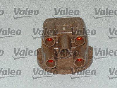 Komponente der Marke 'Valeo' mit vier zylindrischen Anschlüssen, wahrscheinlich ein Verteilerdeckel für ein Zündungssystem eines Motors.