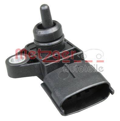 Metzger Autoteile' markierter Automotive-Sensor mit einer kleinen zylindrischen Komponente auf einer rechteckigen Basis mit einem elektrischen Anschluss.