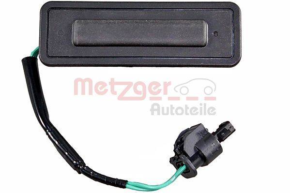 Ein schwarzer Fahrzeugsensor mit Kabelung ist zu sehen. Das Bild enthält den Text 'Metzger Autoteile' in rot.