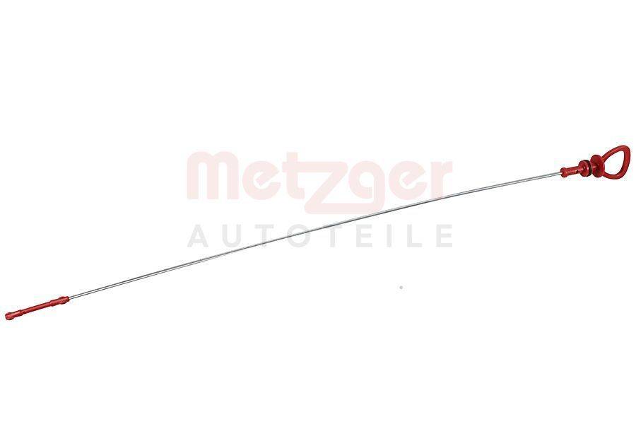 Eine lange, dünne Metallstange oder ein Rohr ist diagonal vor einem weißen Hintergrund positioniert, auf dem schwach der Text 'Metzger Autoteile' zu lesen ist.