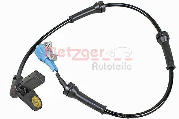 Ein schwarzes Kabel mit Anschlüssen und einer kleinen Metallhalterung, höchstwahrscheinlich ein Automobilbauteil. Hintergrundtext lautet 