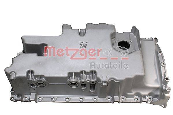 Silberner Motorventildeckel mit 'Metzger Autoteile' Logo und Teilenummer '7090191 03/22', mit mehreren Befestigungslöchern und einer Dichtungsnut.