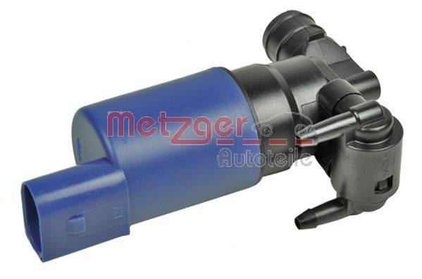 Eine von 'Metzger Autoteile' markierte blaue und schwarze zylindrische Komponente, höchstwahrscheinlich ein Automobilbauteil, mit Düsenanbindungen.