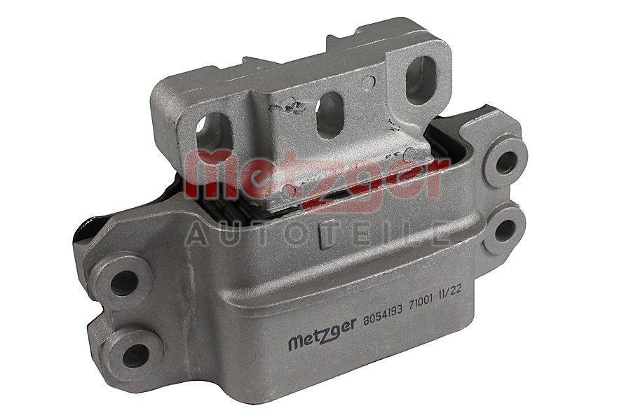 Eine metallische Motorhalterung mit dem Logo 'Metzger Autoteile', die Befestigungslöcher und eine strukturelle Konstruktion aufweist, verwendet zur Reduzierung von Motorvibrationen in Fahrzeugen.