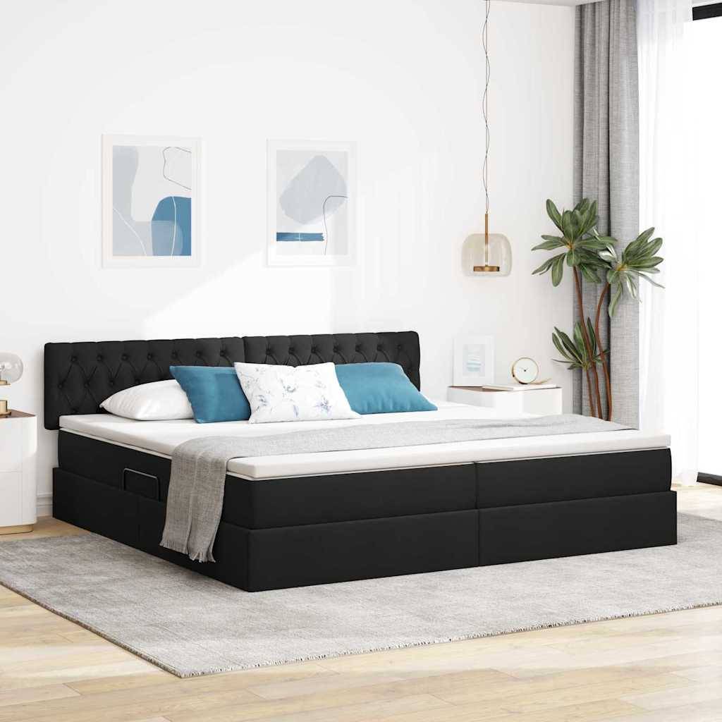 Ein modernes Schlafzimmer zeigt ein schwarzes gepolstertes Bett mit weißer Bettwäsche und blauen Kissen, zwei gerahmte abstrakte Drucke und eine hohe Pflanze.