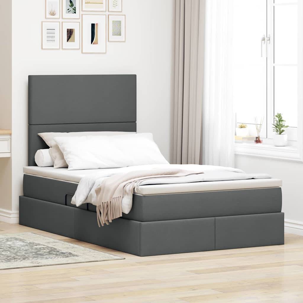 Ein modernes Schlafzimmer mit einem grauen Bett mit verstautem Stauraum, weißer Bettwäsche und einem großen Fenster. Die minimalistische Dekoration umfasst gerahmte Kunstwerke.