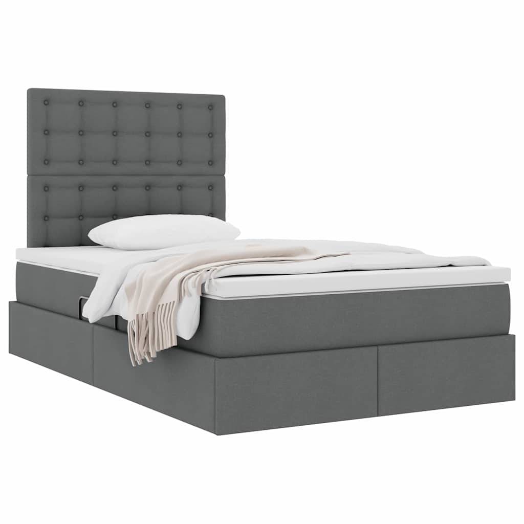 Grau gepolstertes Bett mit gestepptem Kopfteil, weißem Kissen und beigefarbener Decke, präsentiert auf weißem Hintergrund.