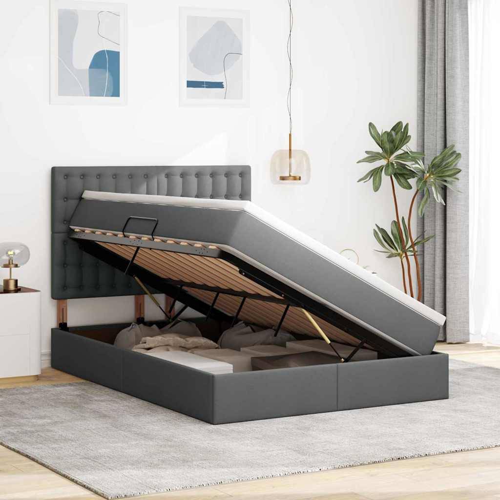 Ein grau gepolstertes Bett mit erhöhter Matratze gibt Stauraum darunter frei. Der Raum hat eine minimalistische Einrichtung mit Pflanzen und Kunstwerken an den Wänden.