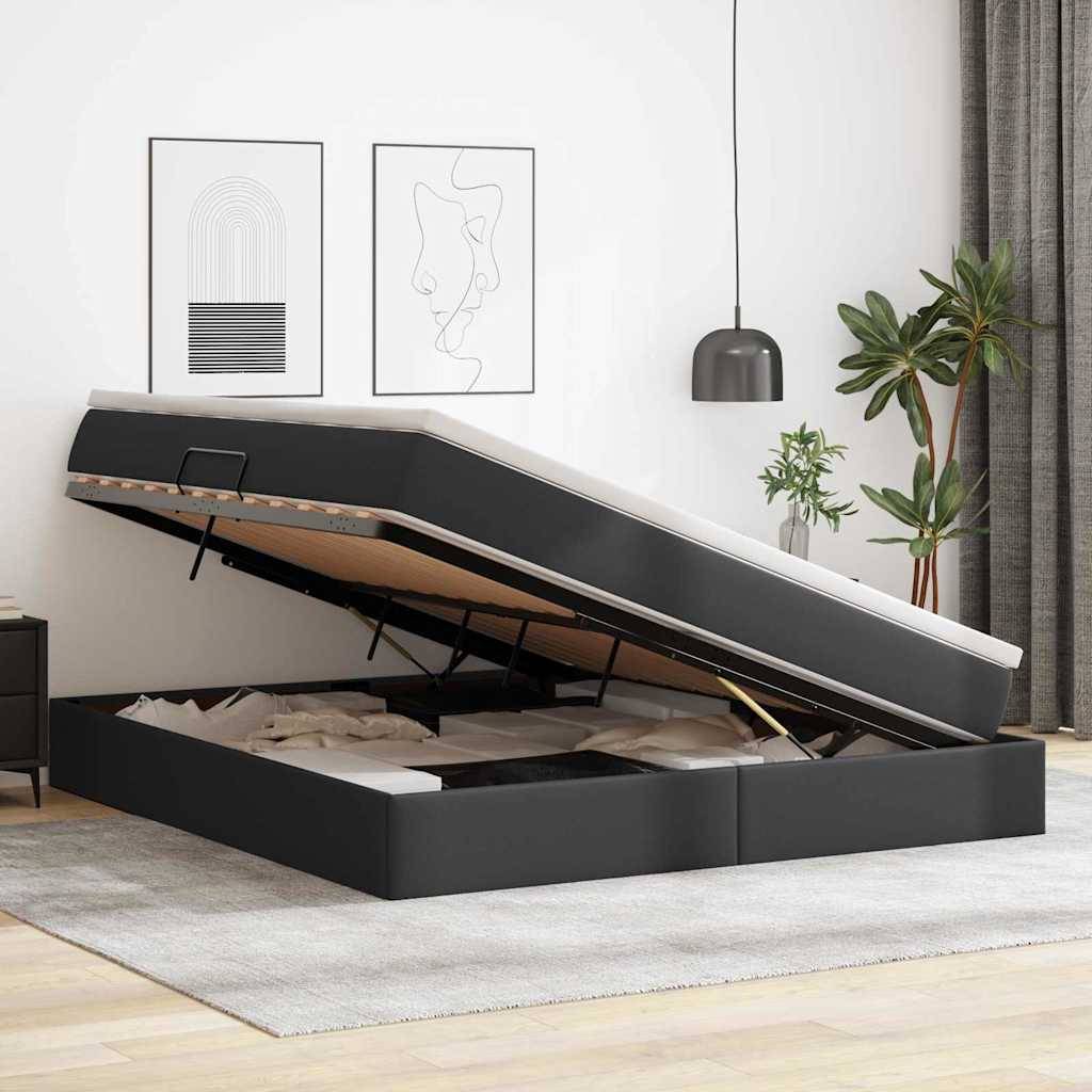 Ein modernes Schlafzimmer mit einem dunklen Stauraumbett, dessen Fach geöffnet ist. Über dem Bett hängen zwei abstrakte gerahmte Kunstwerke. Rechts davon hängt eine Pendelleuchte.