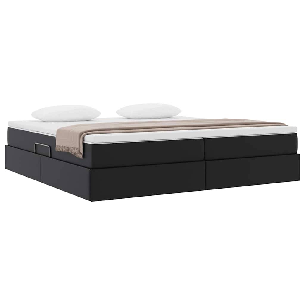 Ein modernes, minimalistisches schwarzes Bett mit einer weißen Matratze, zwei weißen Kissen und einer braunen Decke, die am Fußende gefaltet ist, aus einem Winkel betrachtet.