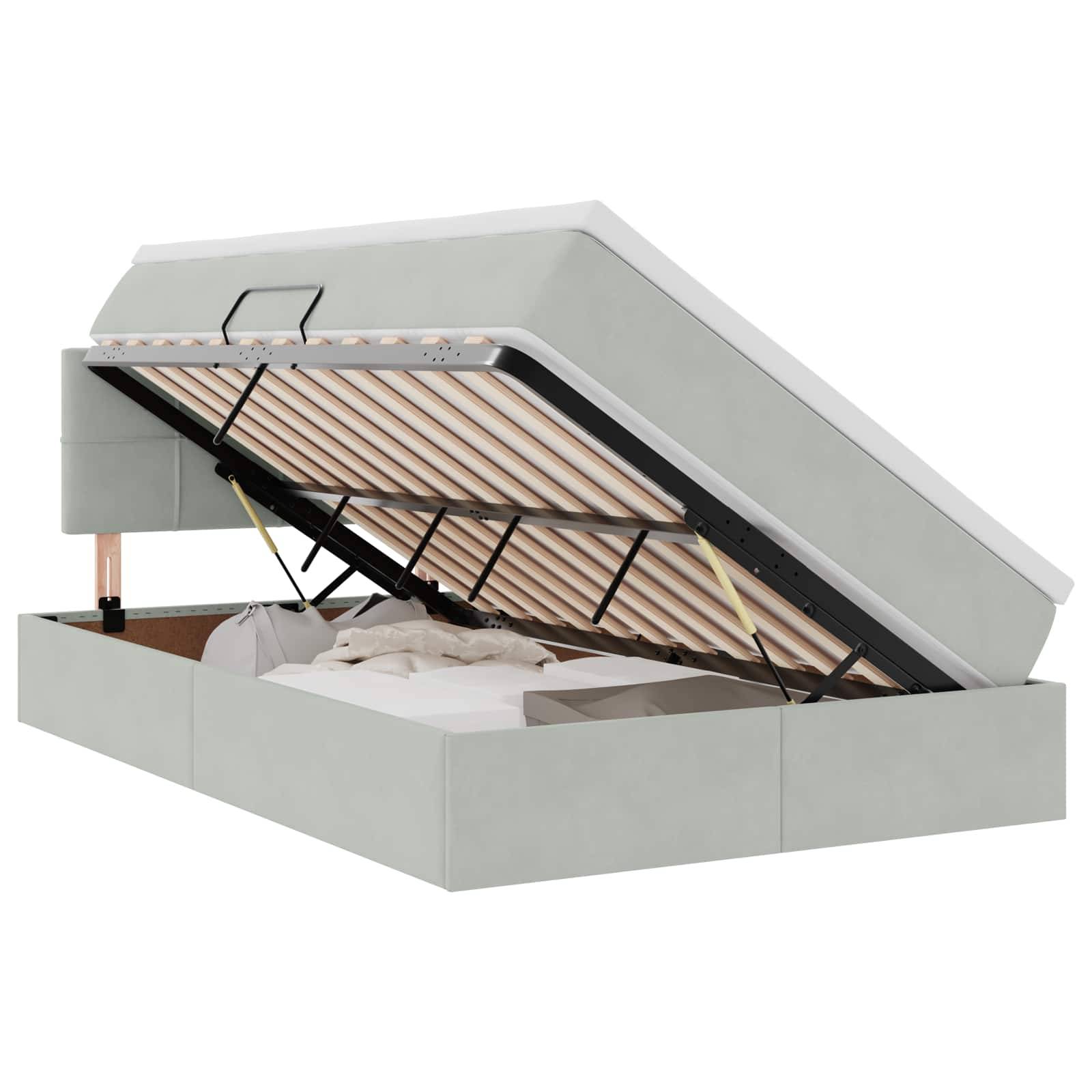 Ein grauer Polster-Boxspringbett mit angehobenem Bettlattenrost, der einen darunter liegenden Stauraum mit Bettwäsche und Decken gefüllt enthüllt.