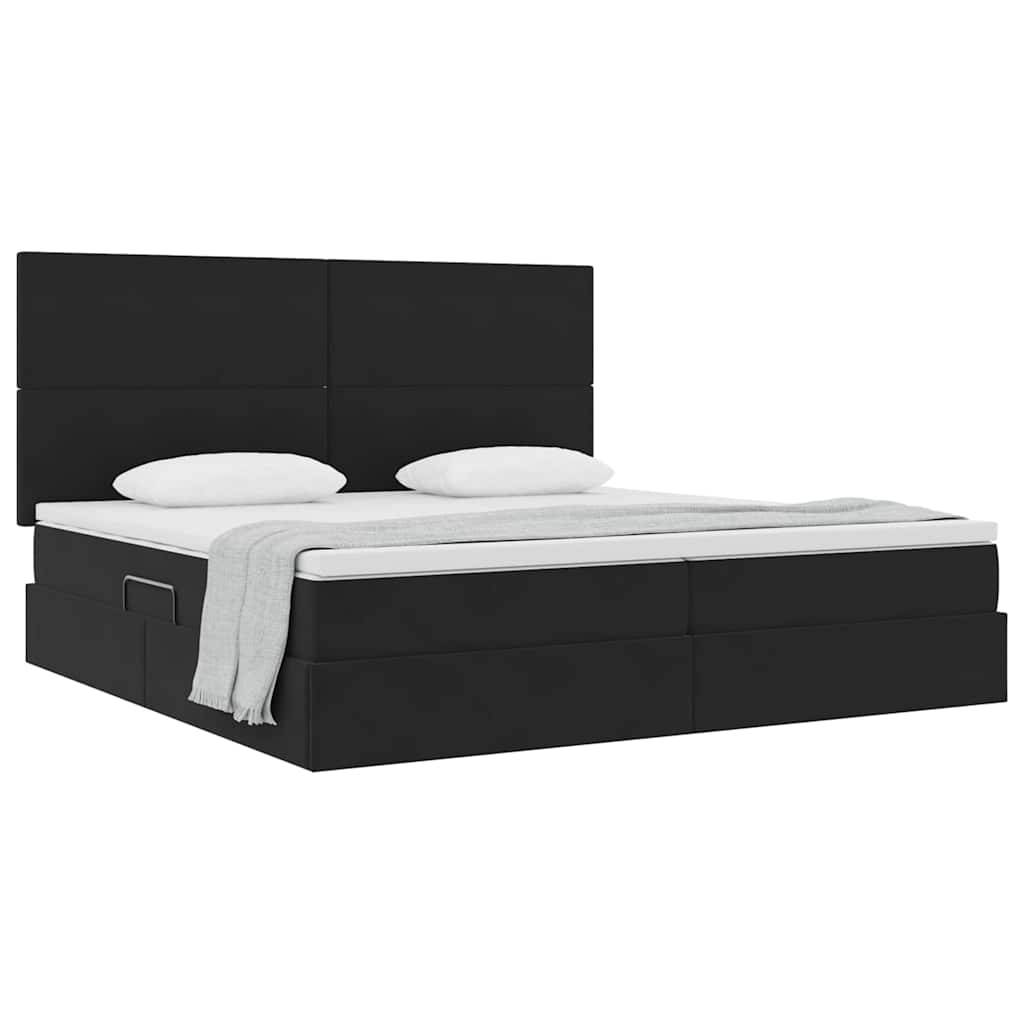 Ein modernes schwarzes Doppelbett mit minimalistischem Design, ausgestattet mit zwei weißen Kissen und einer zusammengelegten grauen Decke am Fußende des Bettes.