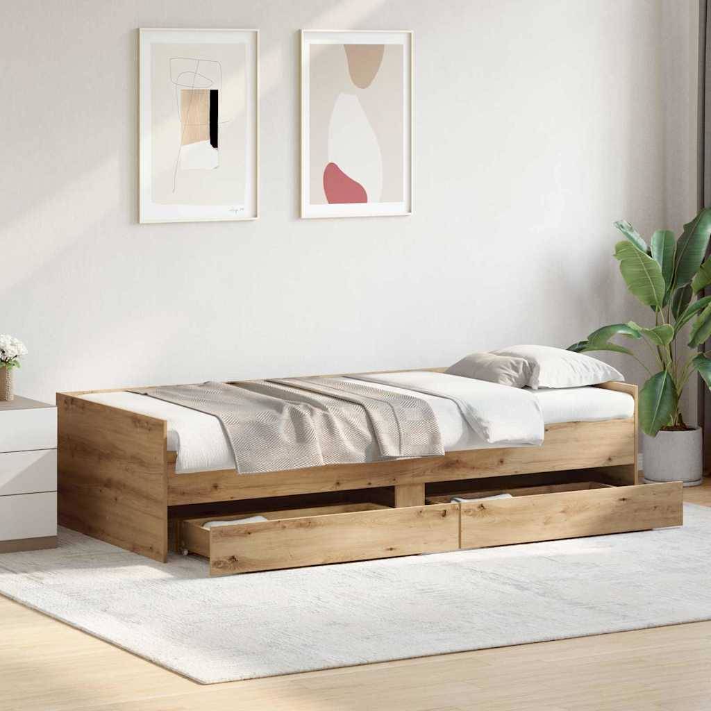Holzbett mit Schubladen zur Aufbewahrung in einem minimalistischen Schlafzimmer, mit Wandkunst, einer Topfpflanze und einem weichen Bereichsteppich auf hellem Boden.
