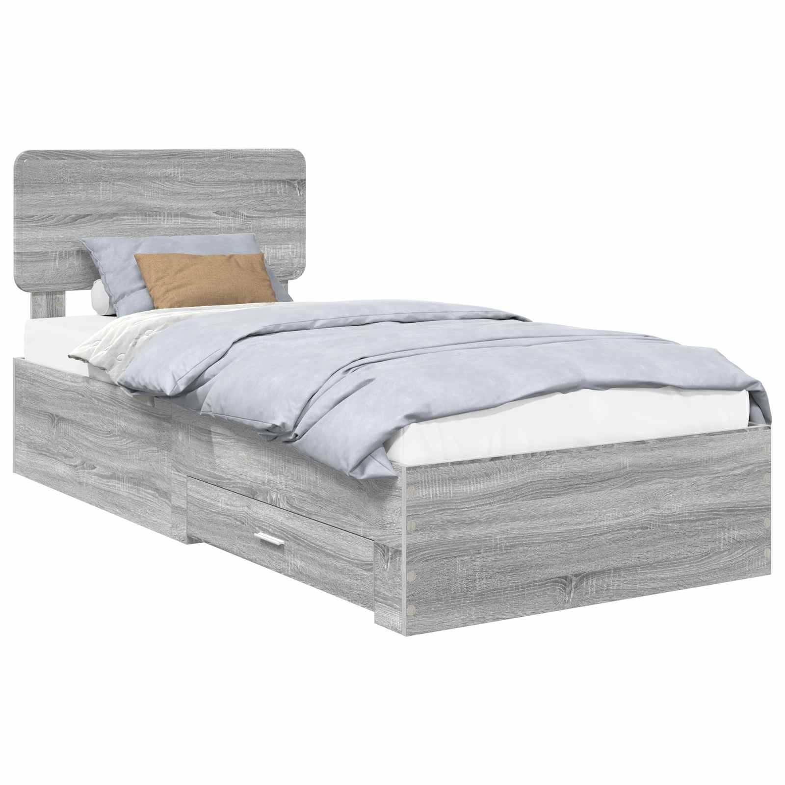 Ein modernes graues Zwillingsbett mit Staurageschubladen darunter und einem Kopfteil. Das Bett hat eine Holzoptik und ist mit Kissen und einer Bettdecke ausgestattet.