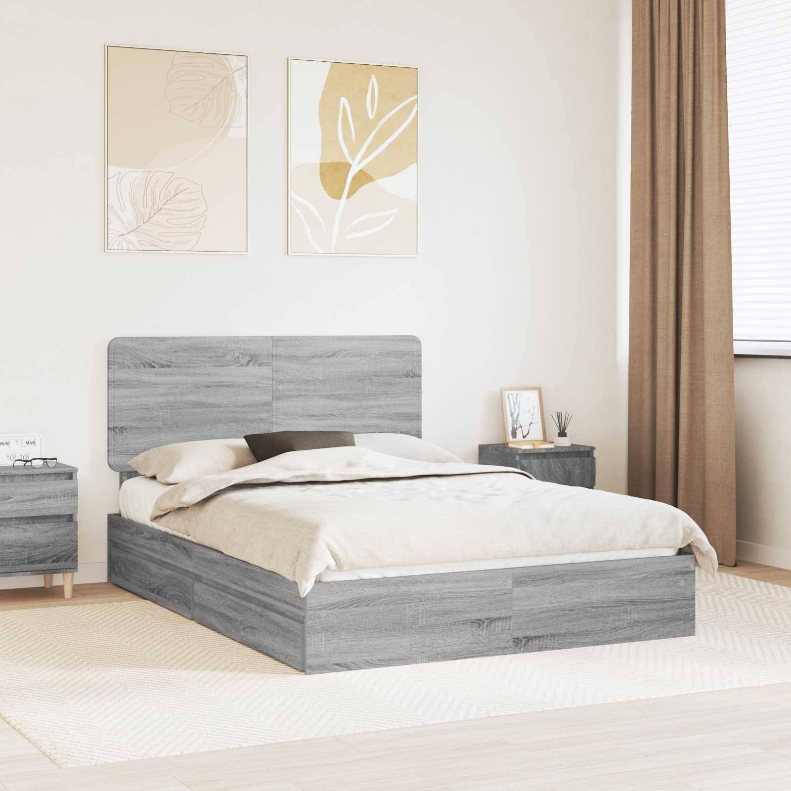 Ein modernes Schlafzimmer mit einem grauen Holzbett, passendem Nachttisch, weißer Bettwäsche und zwei minimalistischen Kunstwerken mit Pflanzenmotiven an der Wand.