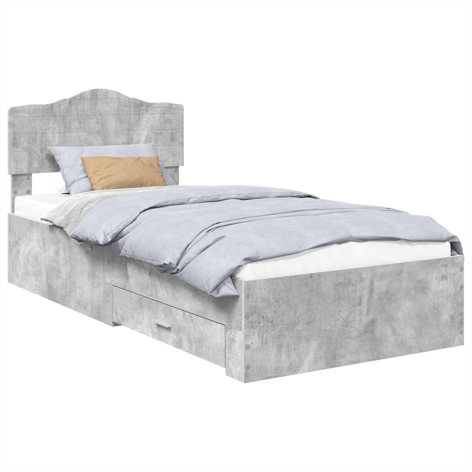 Ein Einzelbett mit betonähnlicher Oberfläche, blaue Bettwäsche und ein beiges Kissen. Die Basis verfügt über Schubladen zum Aufbewahren.