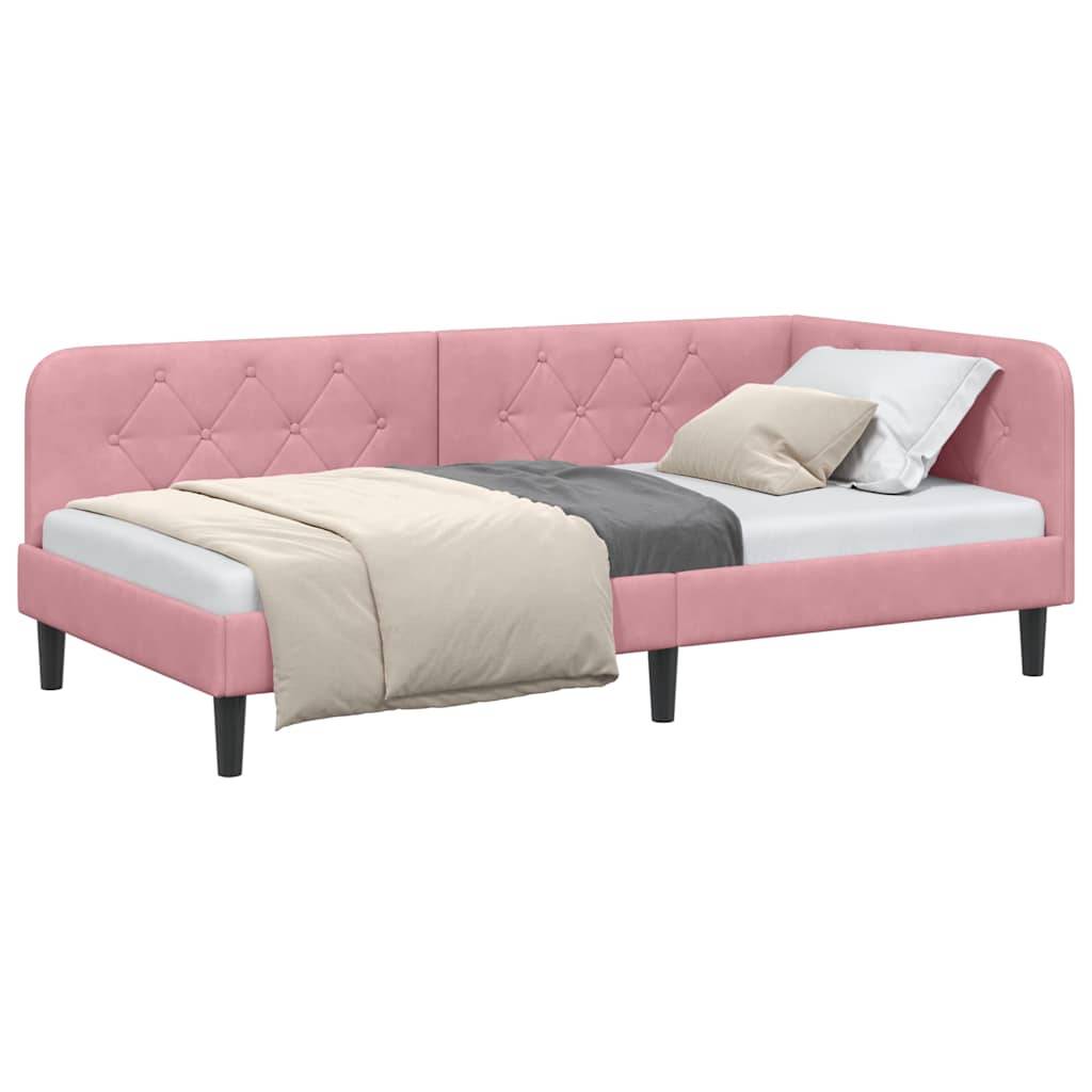 Ein rosa gepolstertes Eck-Tagessofa mit gestepptem Design und schwarzen Beinen, ausgestattet mit beige- und graufarbener Bettwäsche und zwei Kissen.