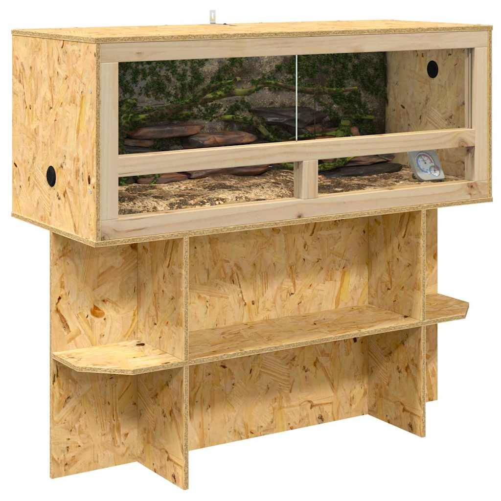 Holz-Reptiliengehege mit Glasfront, ausgestattet mit einem Thermometer und natürlichem Pflanzen-Hintergrund, platziert auf einem Holzständer.