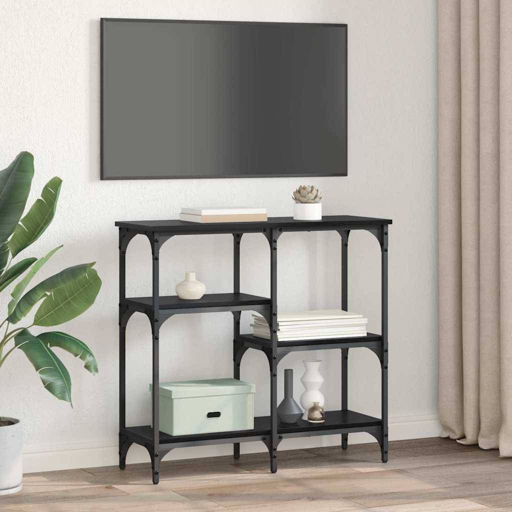 Ein Konsoltisch aus Metall und Holz steht an einer Wand. Er trägt Bücher, eine grüne Box und Dekorationsgegenstände. Eine Pflanze steht daneben.