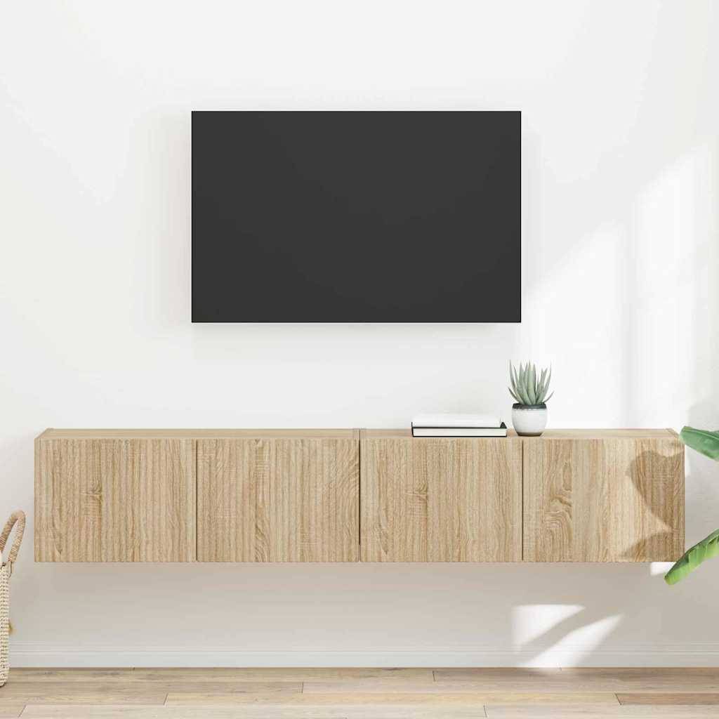 Ein minimalistisches Wohnzimmer mit einem an der weißen Wand montierten Fernseher, einem schwebenden Holzschrank darunter und einer Topfpflanze als Dekoration.