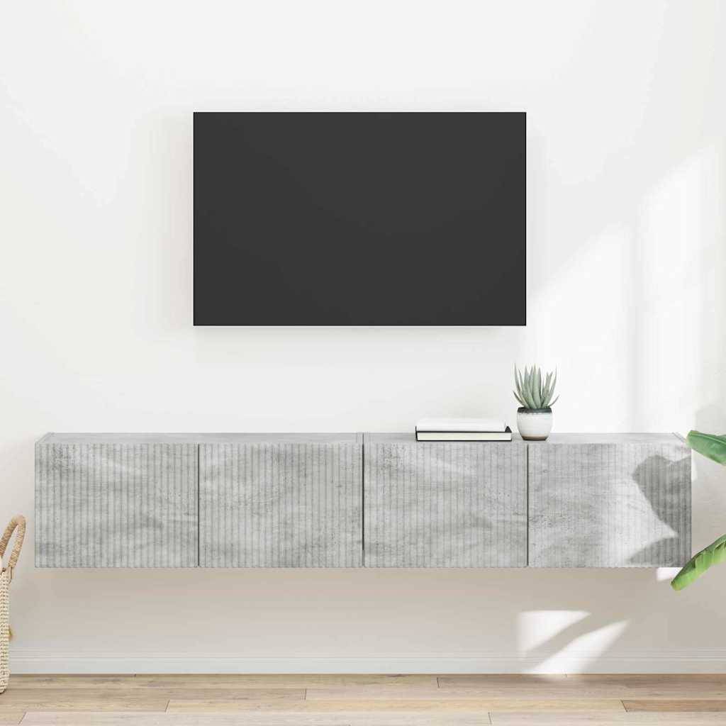 Ein moderner, minimalistischer Wohnraum mit einem grauen schwebenden Schrank, einer schwarzen rechteckigen Wanddekoration und einer kleinen Pflanze auf dem Schrank.
