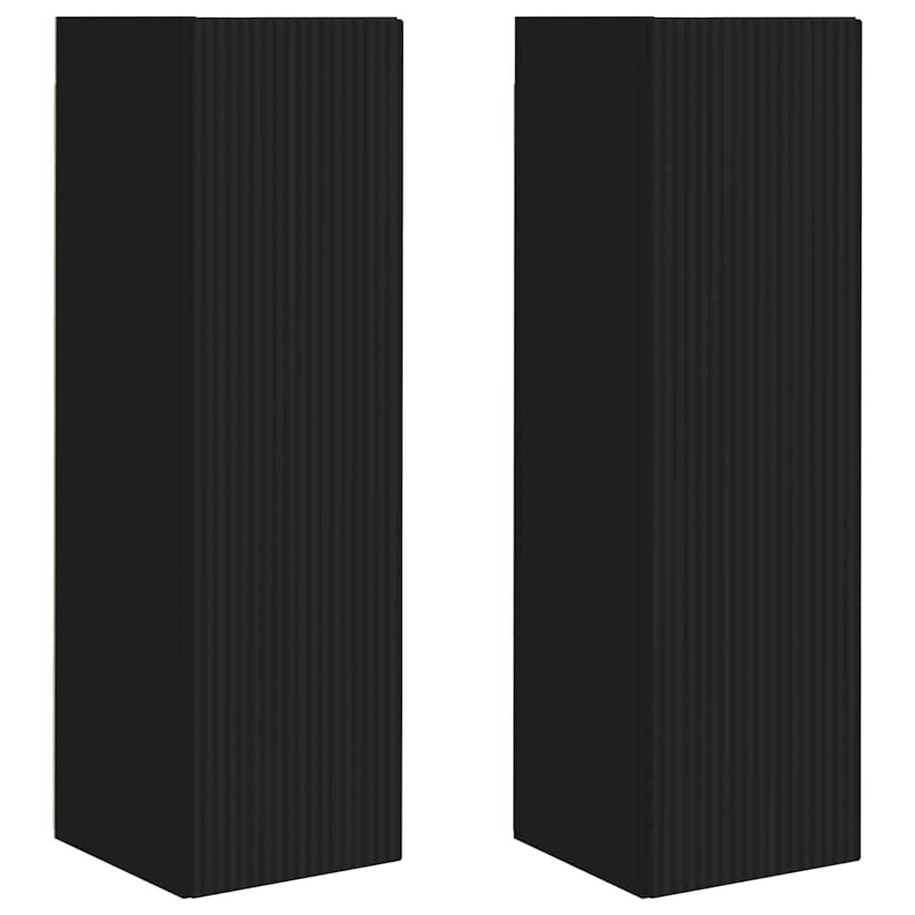 Zwei hohe, rechteckige schwarze Lautsprecher mit gerippten Oberflächen stehen nebeneinander.