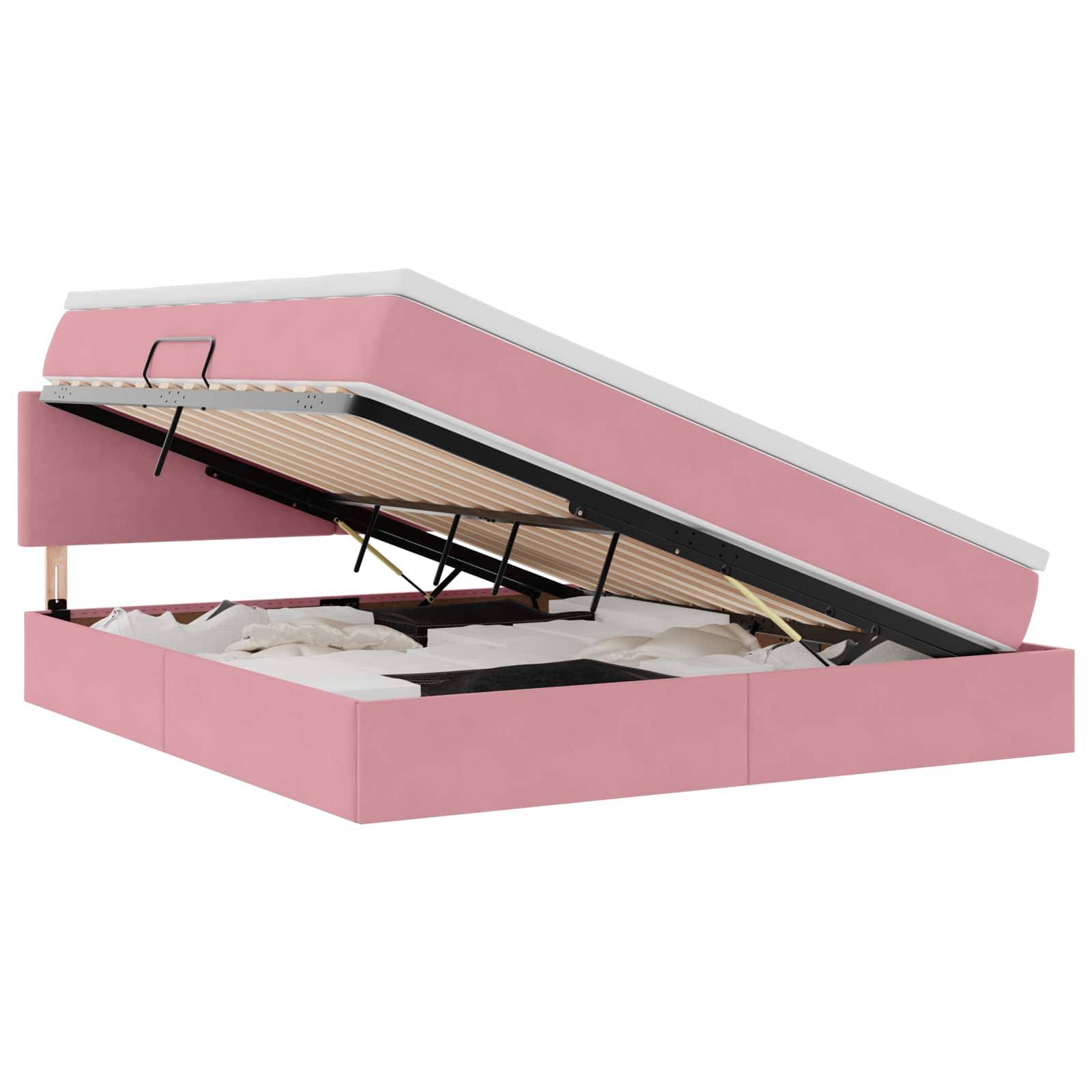 Ein rosa Bett mit einem offenen Stauraum unter der Matratze, in dem weiße Kissen und Decken zu sehen sind.